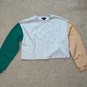 forever 21 medium grey long sleeved shirt with a green and khaki colored sleeve